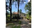 View of house with driveway, two-car garage, wooden steps, siding, and roof at 6070 Ridge Way, Douglasville, GA 30135
