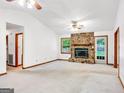 Spacious living room featuring fireplace, large windows, and neutral color palette at 110 Thompson Blvd, Stockbridge, GA 30281
