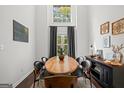 Dining area featuring high ceilings, bright windows, and contemporary decor at 2698 Pleasant Grove Church Rd, Villa Rica, GA 30180