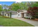 Charming home with mature landscaping, attached garage, and lovely curb appeal at 2698 Pleasant Grove Church Rd, Villa Rica, GA 30180