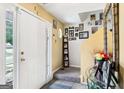 Inviting entryway with tile flooring, decorated walls, and a view of the carpeted stairs at 179 Parkside Dr, Stockbridge, GA 30281