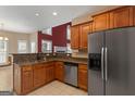 Kitchen featuring stainless steel appliances, granite countertops, and ample cabinet space at 21 Highbush Ct, Sharpsburg, GA 30277