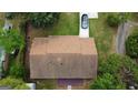 Aerial view showcasing the home's roof, surrounding greenery, driveway and a car parked in front of the house at 7336 Howard Cir, Jonesboro, GA 30236
