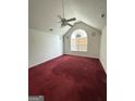 Spacious bedroom featuring vaulted ceilings, a fan, and a window that brings in ample natural light at 1130 Ivey Ln, Mcdonough, GA 30253