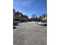 Street view featuring townhouses and ample parking on a sunny day at 3209 Abbeywood Dr, Decatur, GA 30034