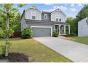 Well-maintained home featuring a two-car garage, with a charming front yard at 1953 Azure Grove Ct, Marietta, GA 30008