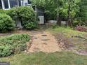 Well-maintained yard with stone path, landscaping and a white picket fence at 332 Wyngate Rd, Auburn, GA 30011