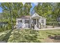 A quaint one-story home boasts a well-manicured lawn and charming front entrance at 1858 Ridgeland Dr, Decatur, GA 30032