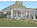 Charming home with a spacious front yard and inviting covered porch and a porte-cochere at 78 Atlanta Se Ave, Atlanta, GA 30315