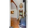 Welcoming entryway showcasing wood floors, an ornate light fixture, and vintage decor at 725 & 761 School Road, Hampton, GA 30228