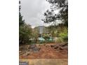 Private backyard featuring a swimming pool and mature trees at 374 Persimmon Dr, Sharpsburg, GA 30277