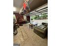 Spacious garage with room for recreation and a convenient sofa at 374 Persimmon Dr, Sharpsburg, GA 30277