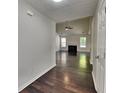 Inviting entryway featuring hardwood floors leading to a spacious living room with a fireplace at 321 Shadowbrooke Dr, Loganville, GA 30052