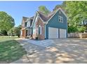 Spacious two-car garage and extended driveway complementing this well-maintained home at 1310 Yarborough Dr, Peachtree City, GA 30269