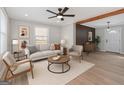 Bright living room featuring modern furniture, wood floors, and abundant natural light at 3650 Adkins Nw Rd, Atlanta, GA 30331