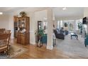 Open-concept living space with hardwood floors, neutral carpet, and seamless flow into the Gathering room at 3226 Puritan Way, Mcdonough, GA 30252