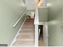 View of the carpeted stairs leading to the upper level of the house at 470 Old Griffin Rd, Hampton, GA 30228