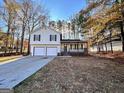 Charming split-level home with a covered front porch and two-car garage at 473 Amy Blvd, Temple, GA 30179