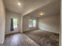 Inviting living room with a door to the outside, complemented by large windows for lots of natural light at 883 Ironhorse Sw Ln, Mableton, GA 30126