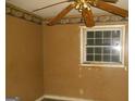 Bedroom with a ceiling fan, a window letting in light, and patterned border trim at 3296 Columbia Woods Dr, Decatur, GA 30032