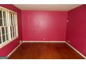 Living room featuring hardwood floors, bright natural light, and fresh paint at 3296 Columbia Woods Dr, Decatur, GA 30032