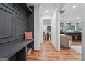 Inviting entryway with convenient built-in storage and bench seating adjacent to the living room and kitchen at 4327 Welligton Hill Ln, Snellville, GA 30039