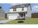 Well-maintained two-story home with a two-car garage, complemented by a green lawn and tasteful landscaping at 432 Cantrell Drive, Dallas, GA 30157