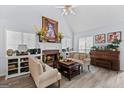 Inviting living room with fireplace, piano, and lots of natural light at 140 Braymoor Cir, Fayetteville, GA 30215