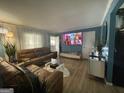 Inviting living room featuring a large sectional sofa and a wall-mounted television at 140 Se Mount Zion Rd # 41, Atlanta, GA 30354