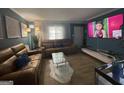 Comfortable living room with plush sofas, modern decor, and a large television at 140 Se Mount Zion Rd # 41, Atlanta, GA 30354