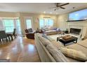 Bright living room with hardwood floors, fireplace, and comfortable seating at 80 Jacksons Vly, Sharpsburg, GA 30277