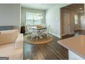 Cozy dining area features a round table, seating for four, and a jute rug at 360 Hayden Cir, Woodstock, GA 30189