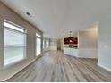 Spacious living room with luxury vinyl plank floors and lots of natural light at 305 Mango Ct, Mcdonough, GA 30253