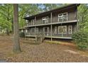 Charming two-story home featuring a double balcony and lush, mature landscaping at 101 Longer Dr, Peachtree City, GA 30269