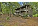 Charming two-story home featuring a double balcony and lush, mature landscaping at 101 Longer Dr, Peachtree City, GA 30269
