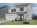 Inviting two-story home with a brick-accented facade and attached two-car garage at 455 Prescott Way, Villa Rica, GA 30180
