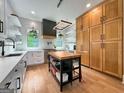 Stylish kitchen with white cabinets, stainless steel appliances, and a center island perfect for cooking at 300 Mado Ln # 329, Chattahoochee Hills, GA 30268