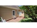 Cozy brick patio with seating, perfect for outdoor relaxation or entertaining at 2897 Macaw Nw St, Atlanta, GA 30318