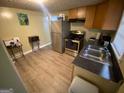Efficient kitchen with stainless steel appliances, ample counter space, and neutral flooring at 5172 Avery Sw St, Covington, GA 30014
