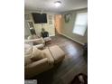Inviting living room with modern flooring, comfortable seating and bright natural light at 5172 Avery Sw St, Covington, GA 30014