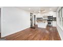 Bright kitchen featuring white cabinets, butcher block countertops, stainless steel appliances, and hardwood floors at 2952 Diana Sw Dr, Atlanta, GA 30315