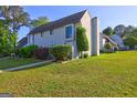 Well-maintained townhome with lush landscaping and a private entrance at 288 Country Club Dr, Jonesboro, GA 30238