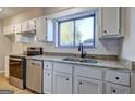 Updated kitchen with stainless steel appliances and granite countertops at 288 Country Club Dr, Jonesboro, GA 30238