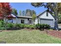 Inviting home exterior showcasing stylish landscaping and architectural charm at 3336 Country Creek Nw Dr, Kennesaw, GA 30152