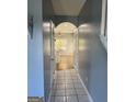Inviting hallway with tile flooring leading into a bright and airy living space at 117 Rendition Dr, Mcdonough, GA 30253