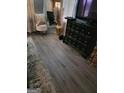 Bedroom showcasing elegant flooring, a decorative stool, vanity mirror, and sleek black dresser at 2443 Shoals Ter, Decatur, GA 30034