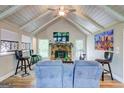 Living room featuring a stone fireplace, wood floors, and comfortable seating at 3861 Hanover Ct, Marietta, GA 30062