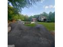 Sprawling home on a large lot with a circular driveway and well-maintained landscaping at 1685 Bailey Creek Sw Rd, Conyers, GA 30094