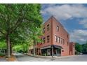Street view of a brick building with a corner location and well-maintained sidewalk at 4173 Raphael St, Covington, GA 30014
