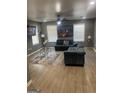 Spacious living room features two couches, an area rug, and a ceiling fan at 1962 Markone Nw St, Atlanta, GA 30318
